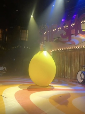 Oversized lemon prop performance in The Manor
