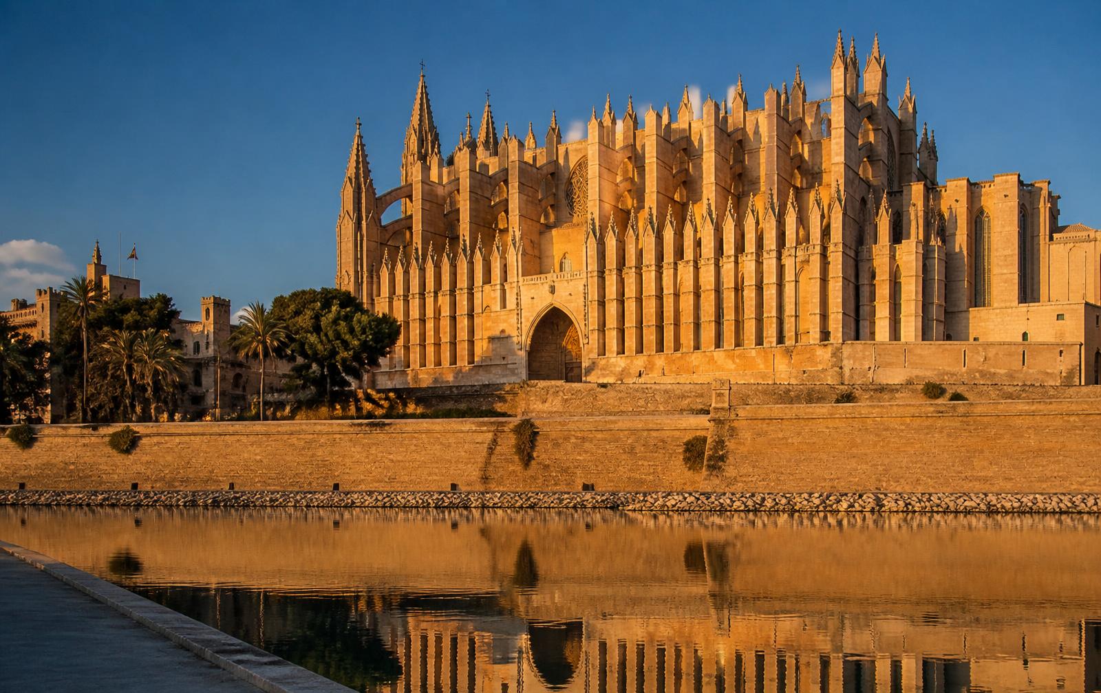 Palma de Mallorca waterfront with La Seu Gothic cathedral reflected in the harbor at golden hour — Balearic Islands port on the 2026 Mediterranean Solar Eclipse Cruise