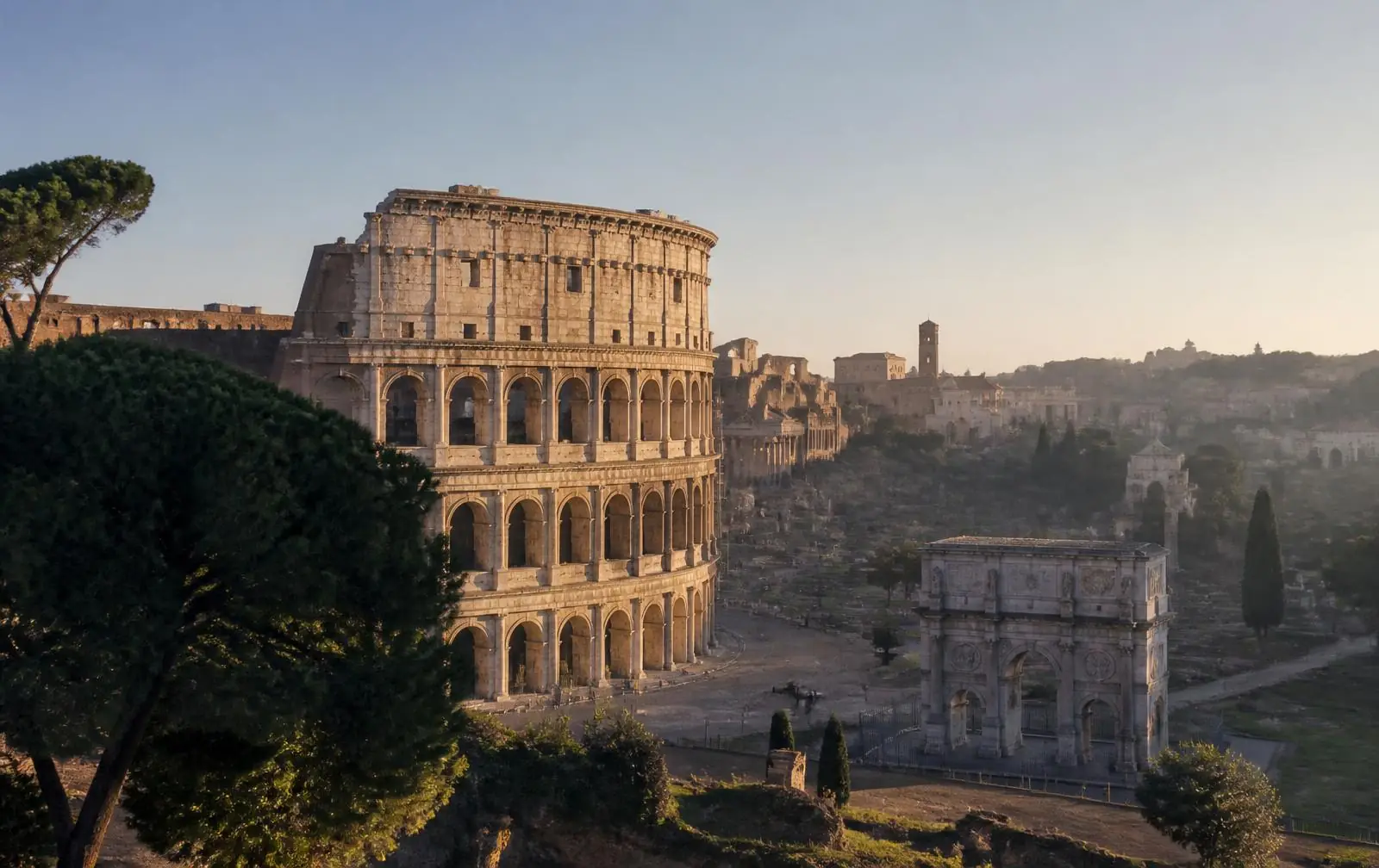 Aerial editorial view of the Colosseum in Rome at golden hour, disembarkation port at Civitavecchia for the 2026 Mediterranean Solar Eclipse Cruise