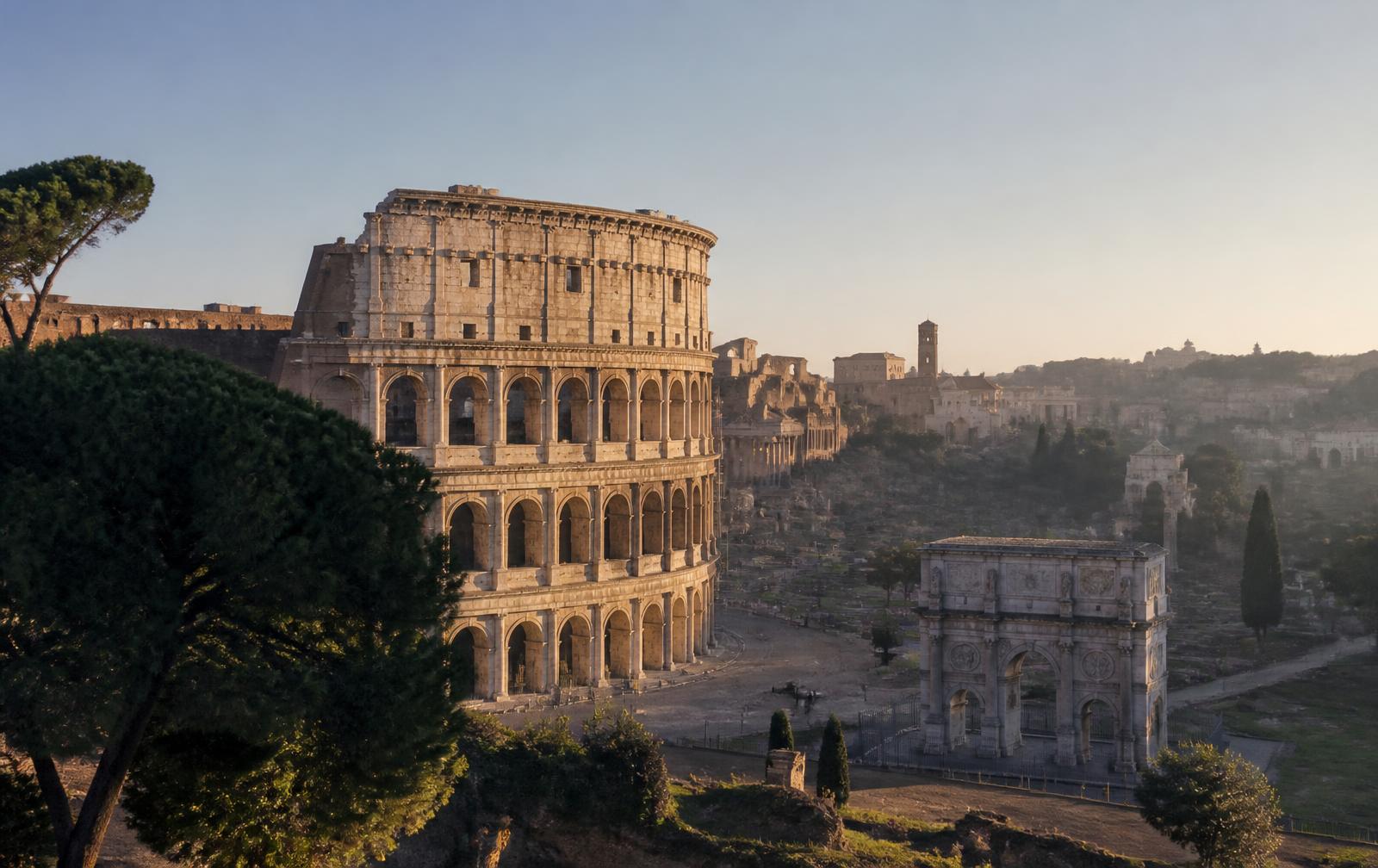 Aerial editorial view of the Colosseum in Rome at golden hour — disembarkation port at Civitavecchia for the 2026 Mediterranean Solar Eclipse Cruise